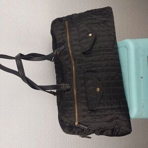 Source unknown -Black quilted satin travel bag